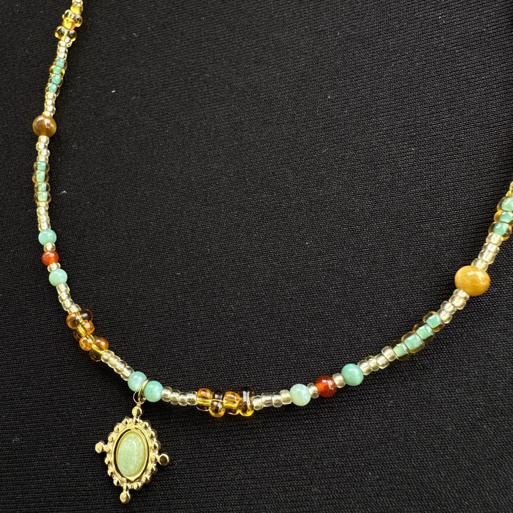 Elegant Beaded Necklace with Gold Pendant